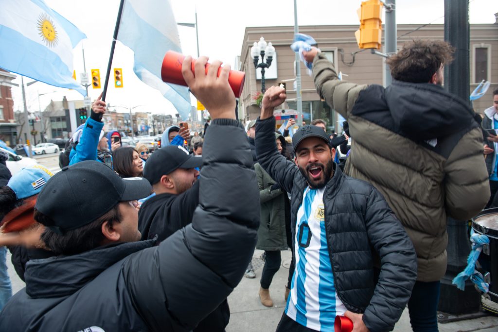 Argentina fans in Toronto celebrating after winning the World Cup finals on St Clair Avenue West